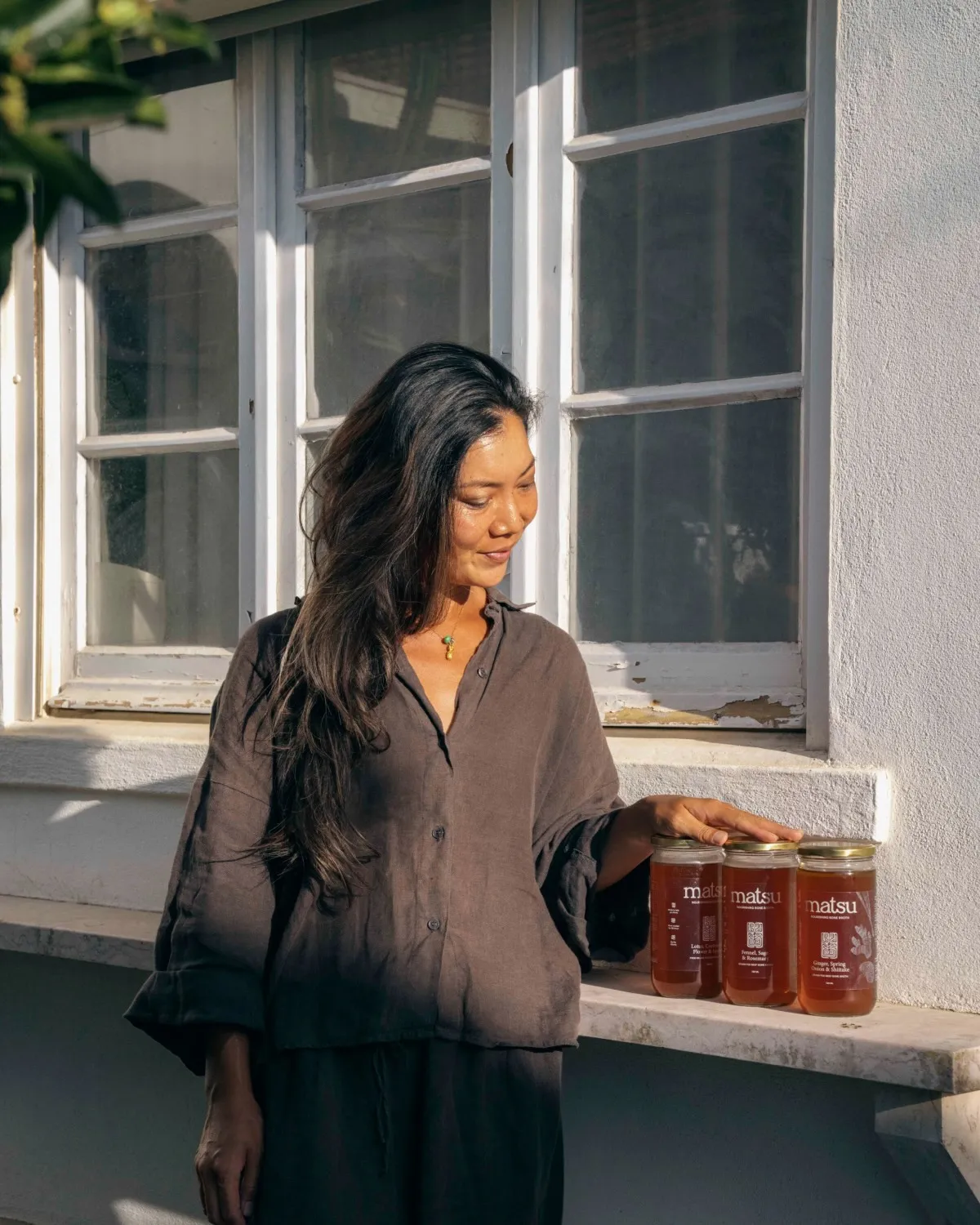 Karen, founder of Matsu, in her Ericeira kitchen beside a stockpot