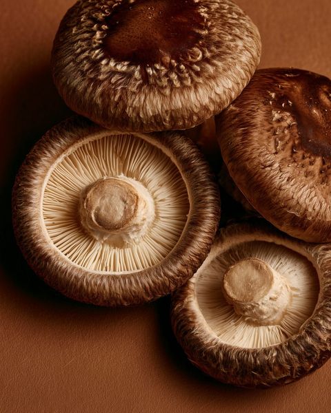 Fresh shiitake mushrooms in a ceramic bowl, a beta-glucan source for immune support in our broth
